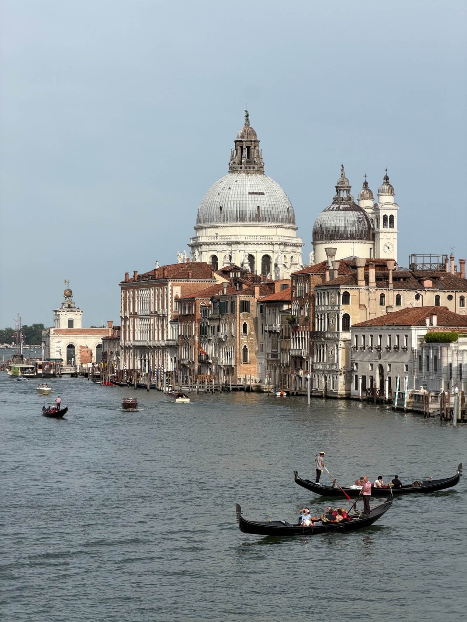 A canal with several gondolas in Venice
